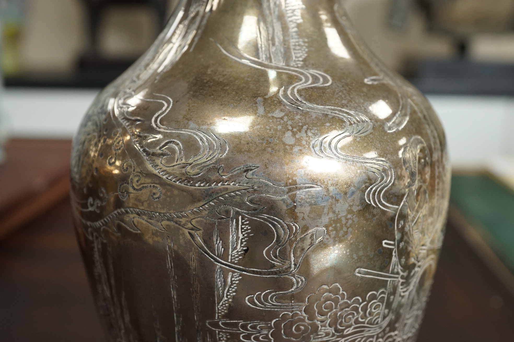A pair of Chinese silver ‘immortals’ vases, late 19th century